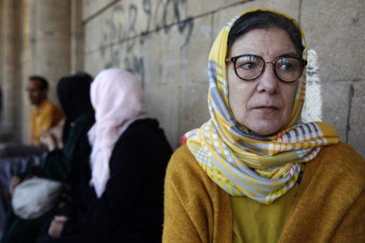 Souad El Khammal, cuyo marido Abdeluahed y su hijo adolescente Tayib murieron en el ataque a la Casa de España el 16 de mayo de 2003, visita el cementerio. EFE/ María Traspaderne